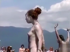 Naked performance art on the beach