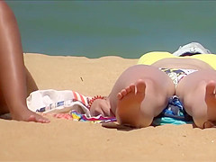 Tanned stunner has her crotch recorded while sunbathing