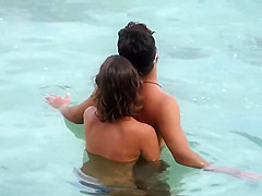 Topless GF captured when giving handjob in the water