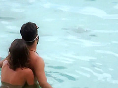 Topless GF captured when giving handjob in the water