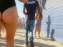 Beach club girl goes to a party in a swimming suit