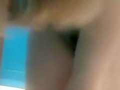 Cute teen putting on a blue bikini