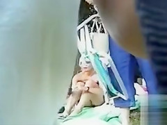 Sexy blonde woman filmed at the beach in voyeur mode