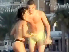 Italian girl fingered hard on the public beach