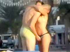 Italian girl fingered hard on the public beach