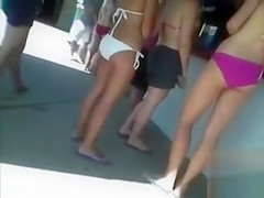Gorgeous maids having a drink in their bikinis