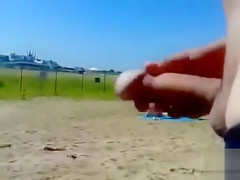 German pervert jerks off to women on topless beach