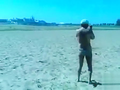 German pervert jerks off to women on topless beach