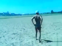 German pervert jerks off to women on topless beach