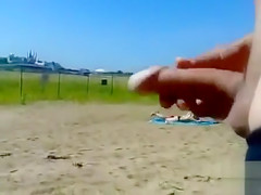 German pervert jerks off to women on topless beach