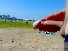 German pervert jerks off to women on topless beach