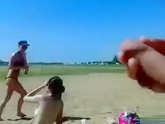 German pervert jerks off to women on topless beach