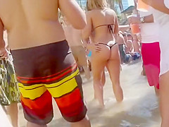 Honey in a flimsy bikini bottom gets her butt taped