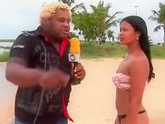 Smoking hot Brazilian sex bomb poses on the sandbeach