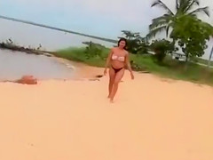 Smoking hot Brazilian sex bomb poses on the sandbeach