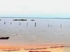 Smoking hot Brazilian sex bomb poses on the sandbeach