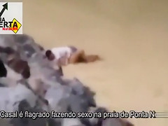 Italian lovers having missionary sex on the beach