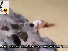 Italian lovers having missionary sex on the beach