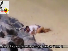 Italian lovers having missionary sex on the beach