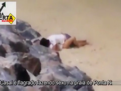 Italian lovers having missionary sex on the beach