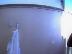 Mature beachgoers get caught on camera showering