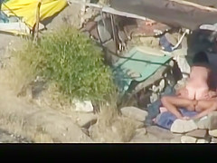 Nude couple banging in the beach