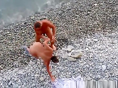 Nudist woman fucked in rocky beach