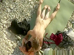 Voyeur films couple fucking in beach