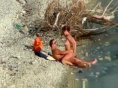Nudist couple fucking by the water