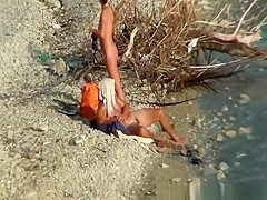 Nudist couple fucking by the water