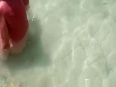 Wife strokes mans penis in beach