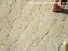Wife strokes mans penis in beach