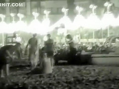 Voyeur films couples at night on a beach