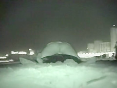 Voyeur films couples at night on a beach