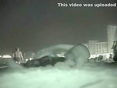Voyeur films couples at night on a beach