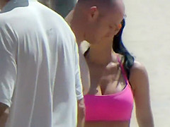 Busty fit girl does a beach workout