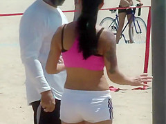 Busty fit girl does a beach workout