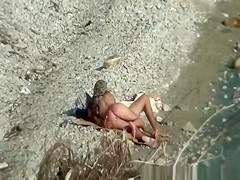 Two nudist couples spied at rocky beach