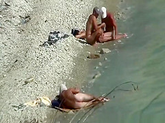 Two nudist couples spied at rocky beach