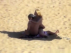 Blonde girl rides her boyfriend’s dick in beach