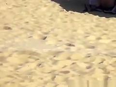 Blonde girl rides her boyfriend’s dick in beach