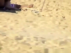 Blonde girl rides her boyfriend’s dick in beach
