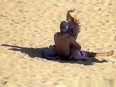 Blonde girl rides her boyfriend’s dick in beach