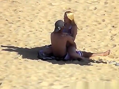 Blonde girl rides her boyfriend’s dick in beach