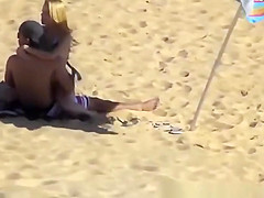 Blonde girl rides her boyfriend’s dick in beach