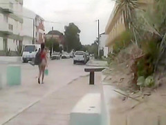 Brunette girl dressing at beach