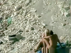 Nudist fucked hard on rocky beach