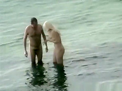 Nudist fucked hard on rocky beach