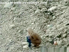 Nudist fucked hard on rocky beach