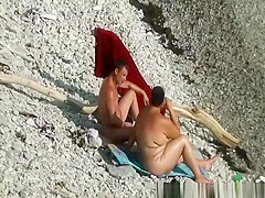 Fat woman blows her man at beach